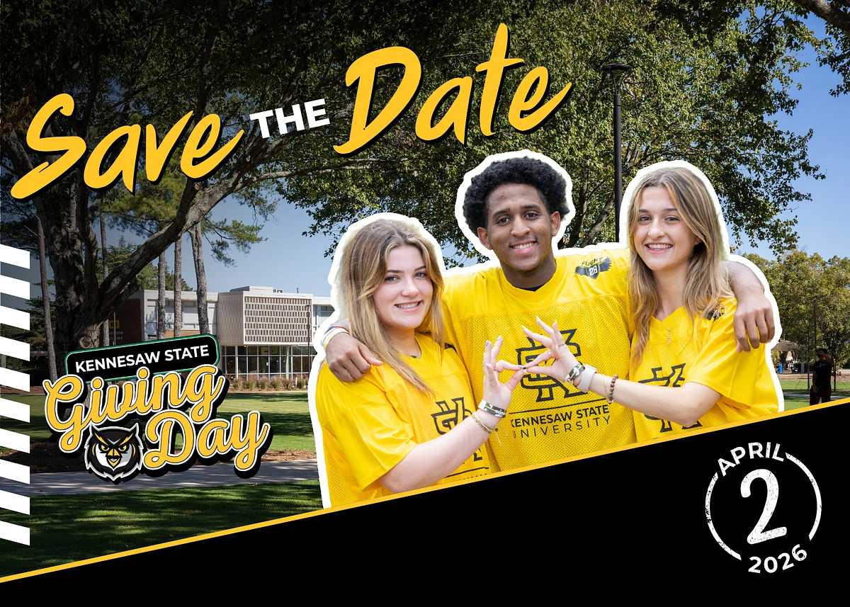 Three students wearing yellow Kennesaw State University shirts smile and pose on campus, promoting "Kennesaw State Giving Day" on April 2, 2026.